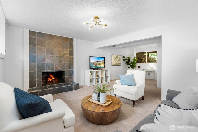 14913 SE 47th Ct, Bellevue, WA 98006 - living room featuring a textured ceiling, carpet flooring, a fireplace, and a chandelier