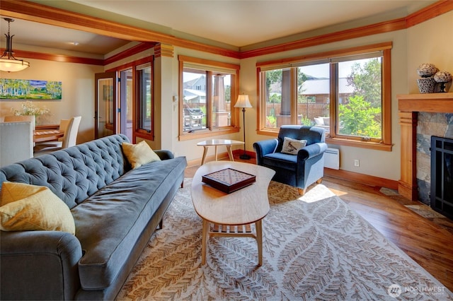 512 May St, Twisp, WA 98856 - living area with wood finished floors, a fireplace with flush hearth, and ornamental molding