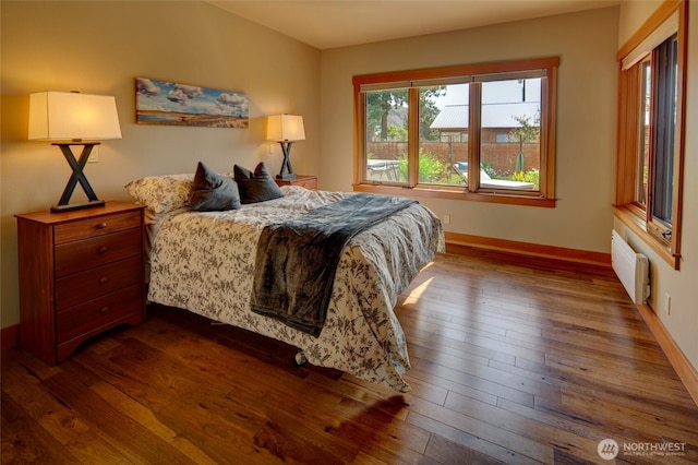 512 May St, Twisp, WA 98856 - bedroom with dark wood-type flooring and radiator heating unit