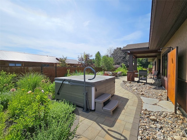 512 May St, Twisp, WA 98856 - fenced backyard featuring a hot tub and a patio