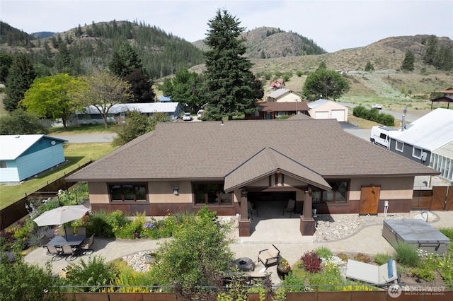512 May St, Twisp, WA 98856 - view of front facade with a mountain view, a shingled roof, and a patio
