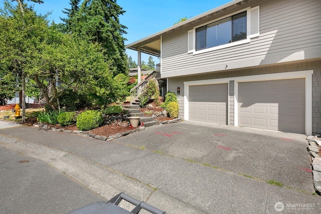 2554 174th Ave NE, Redmond, WA 98052 - view of front of home with a garage, stairway, and driveway