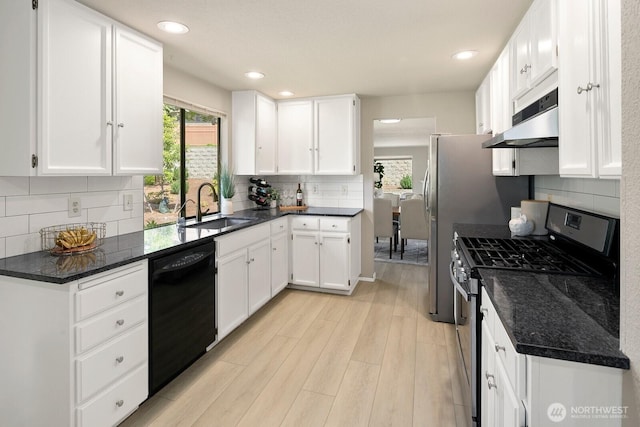 2554 174th Ave NE, Redmond, WA 98052 - kitchen with stainless steel gas stove, dishwasher, under cabinet range hood, plenty of natural light, and recessed lighting