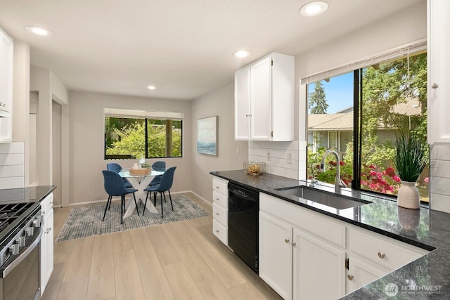 2554 174th Ave NE, Redmond, WA 98052 - kitchen with dishwasher, plenty of natural light, light wood-style floors, tasteful backsplash, and recessed lighting