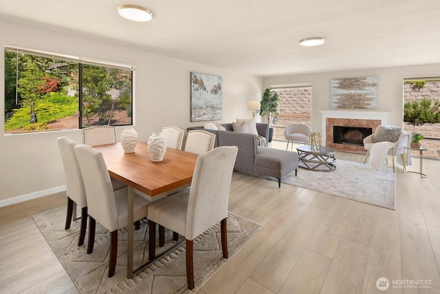 2554 174th Ave NE, Redmond, WA 98052 - dining space featuring light wood-style floors and a tile fireplace