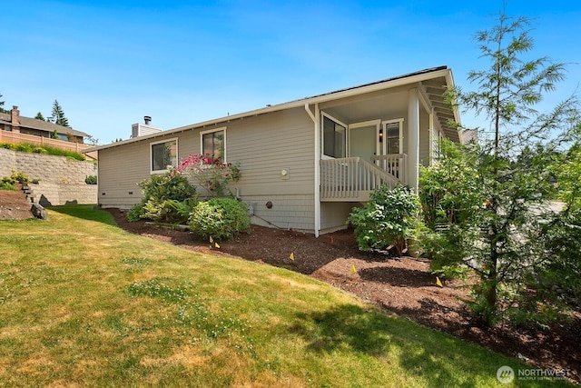 2554 174th Ave NE, Redmond, WA 98052 - back of property with a lawn and a chimney