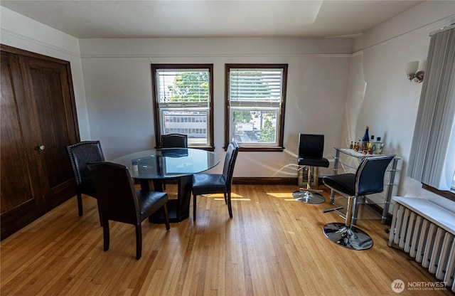 801 Martin Luther King Jr Way, Tacoma, WA 98405 - dining room with radiator heating unit and light wood-type flooring