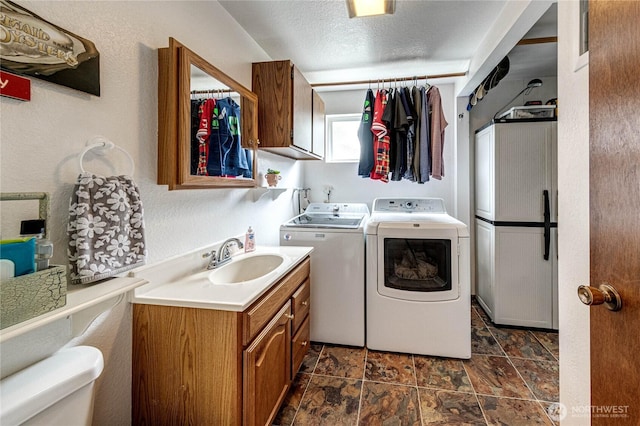 1722 172nd St SE, Bothell, WA 98012 - laundry area with washer and clothes dryer and dark stone finish floors