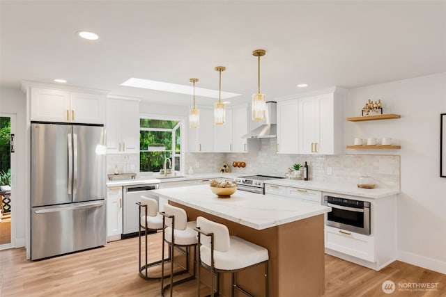 331 137th St SW, Everett, WA 98208 - kitchen featuring appliances with stainless steel finishes, white cabinets, backsplash, light wood-type flooring, and recessed lighting