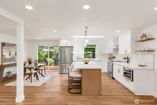331 137th St SW, Everett, WA 98208 - kitchen featuring appliances with stainless steel finishes, plenty of natural light, white cabinets, decorative backsplash, and recessed lighting