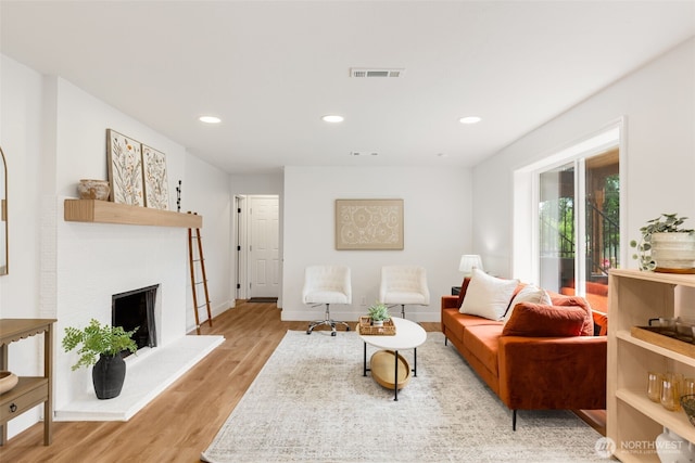 331 137th St SW, Everett, WA 98208 - living room with light wood-type flooring, recessed lighting, and a fireplace with raised hearth