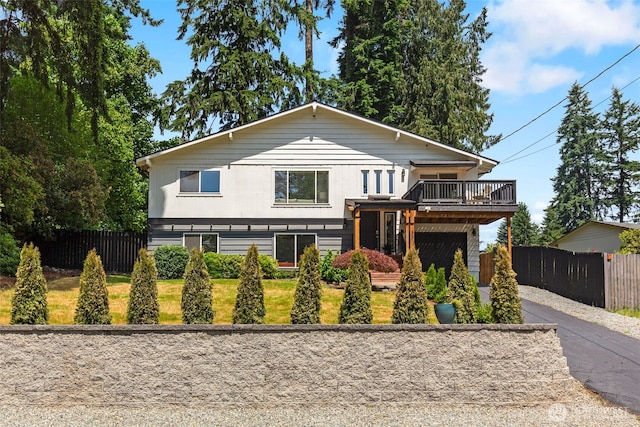 331 137th St SW, Everett, WA 98208 - view of front of home with asphalt driveway, an attached garage, and a wooden deck