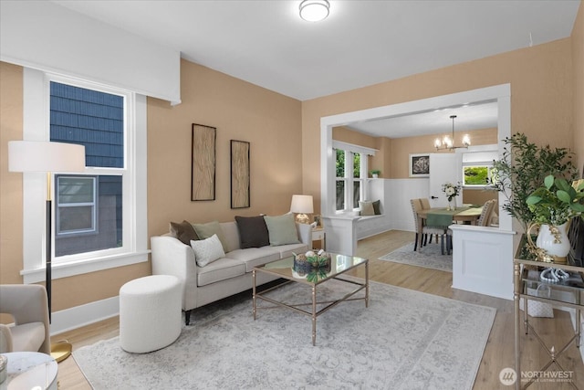 3443 21st Ave W, Seattle, WA 98199 - living area with wood finished floors and a chandelier