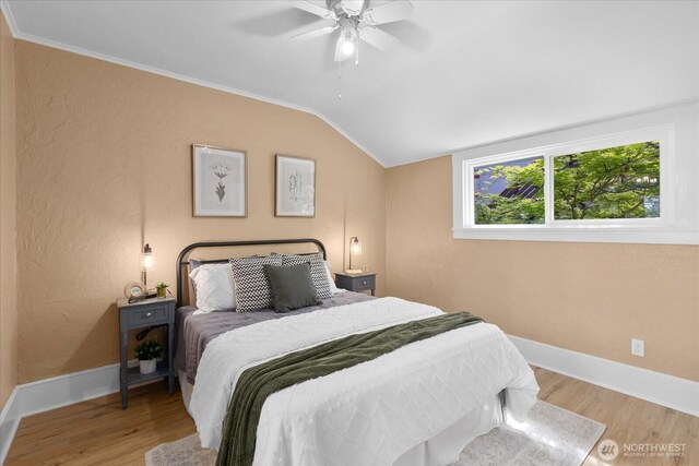 3443 21st Ave W, Seattle, WA 98199 - bedroom with vaulted ceiling, wood finished floors, crown molding, and ceiling fan