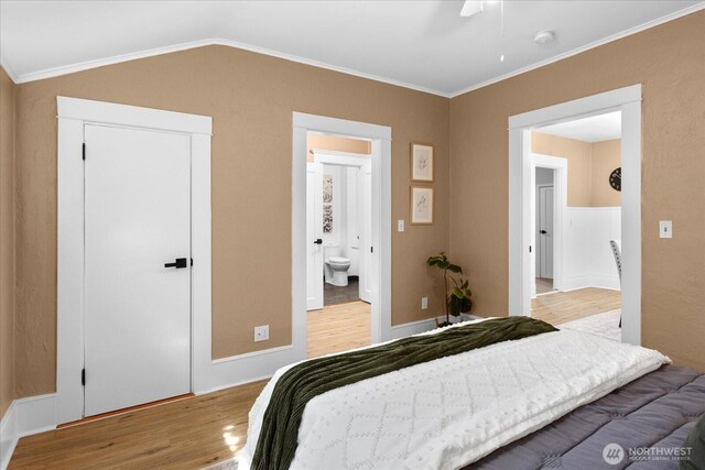 3443 21st Ave W, Seattle, WA 98199 - bedroom with wood finished floors, crown molding, ensuite bathroom, and vaulted ceiling