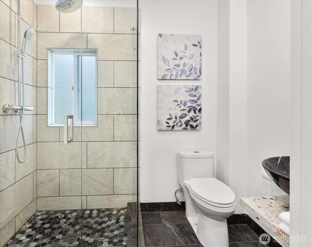 3443 21st Ave W, Seattle, WA 98199 - full bath with a shower stall, vanity, and stone finish floors