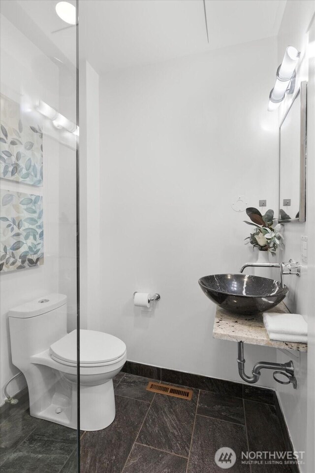 3443 21st Ave W, Seattle, WA 98199 - bathroom with toilet and baseboards