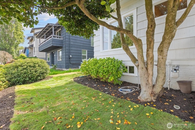 3443 21st Ave W, Seattle, WA 98199 - view of side of home with a yard and a balcony