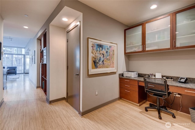 2033 2nd Ave Unit 1608, Seattle, WA 98121 - home office with built in desk, light wood-style flooring, and recessed lighting