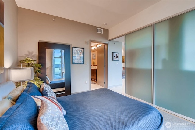 2033 2nd Ave Unit 1608, Seattle, WA 98121 - bedroom with a closet, carpet, and connected bathroom