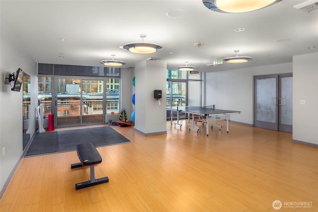 2033 2nd Ave Unit 1608, Seattle, WA 98121 - exercise room featuring french doors and wood finished floors