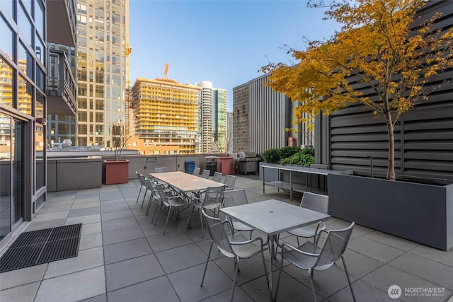 2033 2nd Ave Unit 1608, Seattle, WA 98121 - view of patio featuring outdoor dining area, area for grilling, and a view of city