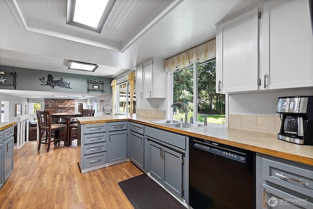 856 Island Blvd, Fox Island, WA 98333 - kitchen featuring dishwasher, gray cabinets, healthy amount of natural light, and light wood finished floors
