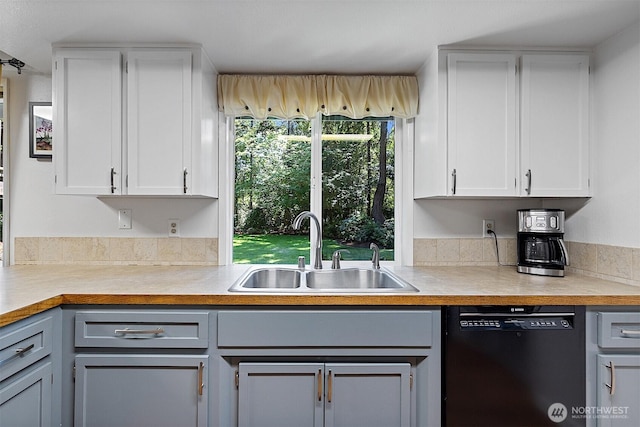 856 Island Blvd, Fox Island, WA 98333 - kitchen with dishwasher, light countertops, and white cabinetry