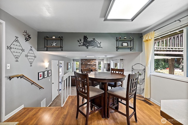 856 Island Blvd, Fox Island, WA 98333 - dining area with light wood-type flooring and baseboards