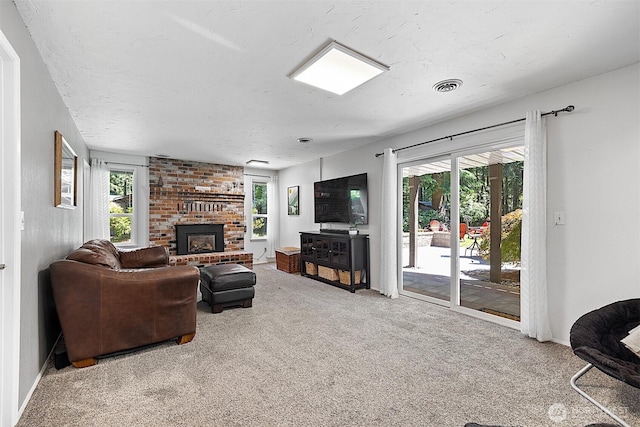856 Island Blvd, Fox Island, WA 98333 - living area with carpet and a brick fireplace
