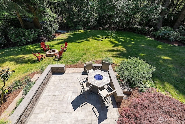 856 Island Blvd, Fox Island, WA 98333 - view of green lawn featuring a fire pit and a patio