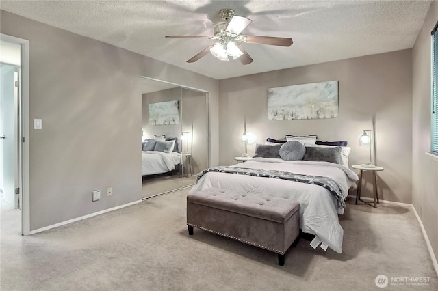 33615 30th Ave SW, Federal Way, WA 98023 - bedroom with carpet, a textured ceiling, a closet, and ceiling fan