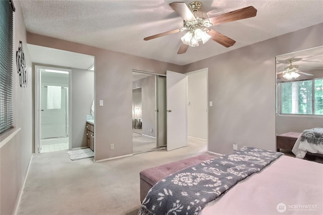 33615 30th Ave SW, Federal Way, WA 98023 - carpeted bedroom with a closet, a textured ceiling, ensuite bathroom, and ceiling fan