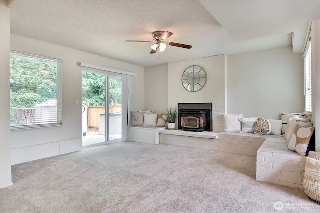 33615 30th Ave SW, Federal Way, WA 98023 - carpeted living area featuring a ceiling fan and a wood stove
