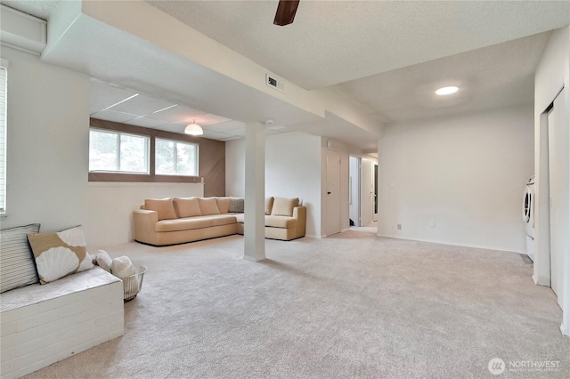 33615 30th Ave SW, Federal Way, WA 98023 - carpeted living room with washer / dryer and a ceiling fan