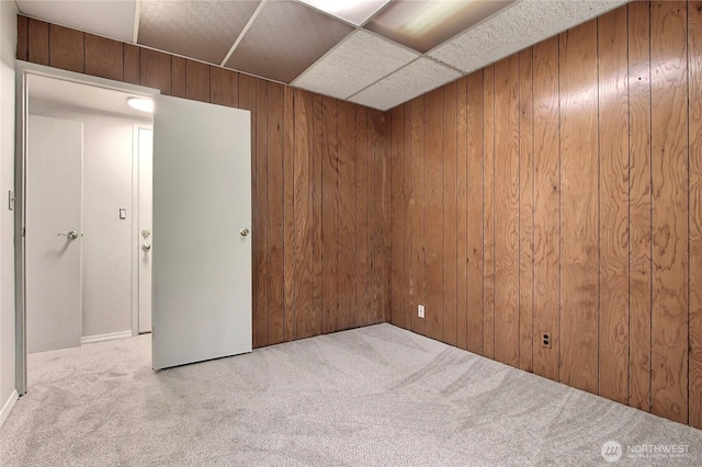 33615 30th Ave SW, Federal Way, WA 98023 - unfurnished room featuring carpet flooring, wooden walls, and a paneled ceiling