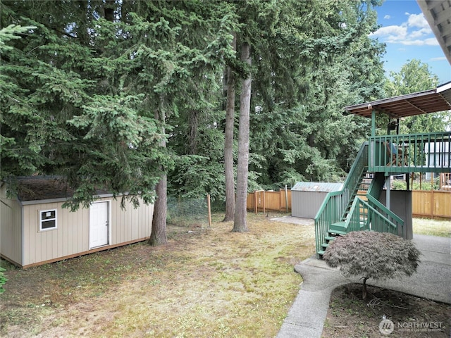 33615 30th Ave SW, Federal Way, WA 98023 - fenced backyard featuring a shed, stairway, and a deck