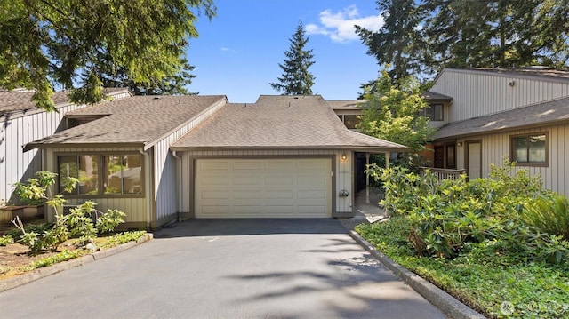 9623 NE Riverbend Dr Unit 2B, Bothell, WA 98011 - townhome / multi-family property with driveway, an attached garage, and roof with shingles