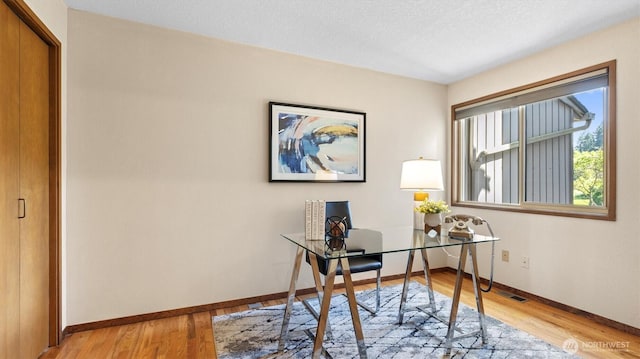 9623 NE Riverbend Dr Unit 2B, Bothell, WA 98011 - office area with light wood-type flooring and a textured ceiling