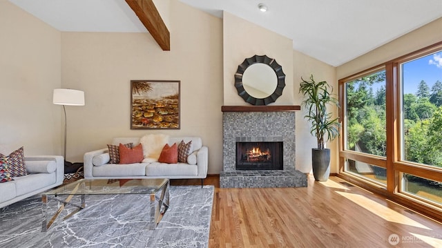 9623 NE Riverbend Dr Unit 2B, Bothell, WA 98011 - living area with wood finished floors and a brick fireplace