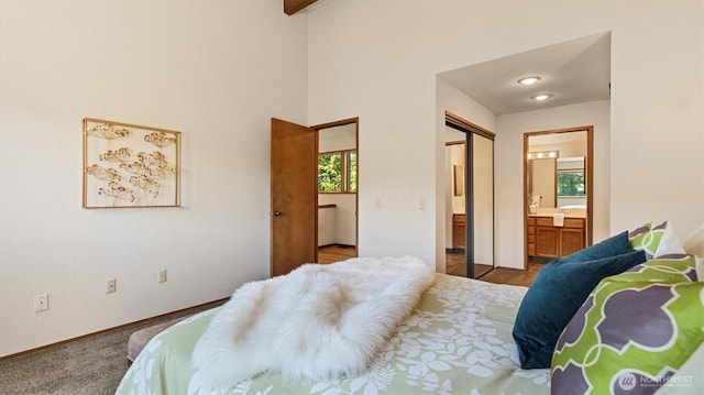 9623 NE Riverbend Dr Unit 2B, Bothell, WA 98011 - carpeted bedroom featuring ensuite bathroom and baseboards