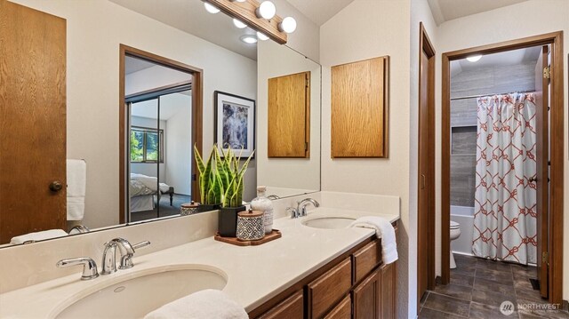 9623 NE Riverbend Dr Unit 2B, Bothell, WA 98011 - full bath with double vanity, ensuite bath, and shower / tub combo with curtain