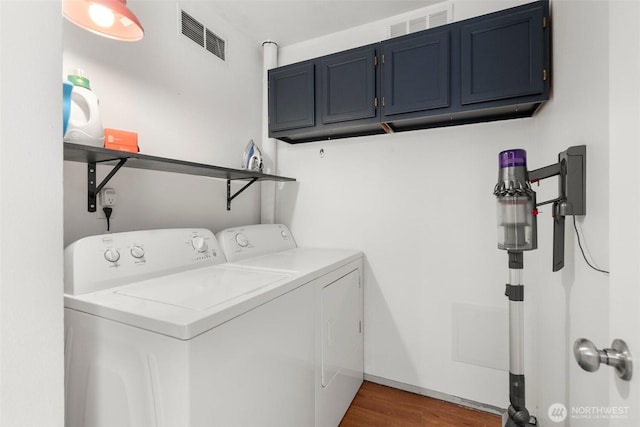 19436 SE 266th St, Covington, WA 98042 - laundry area featuring washer and clothes dryer, cabinet space, and wood finished floors