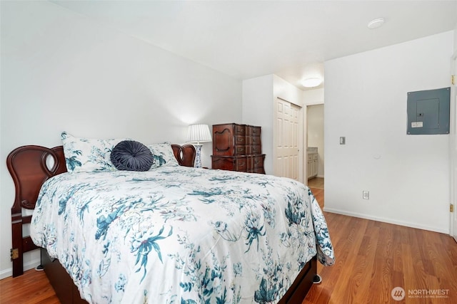 901 E Marine View Dr Unit 206, Everett, WA 98201 - bedroom featuring electric panel, wood finished floors, and a closet