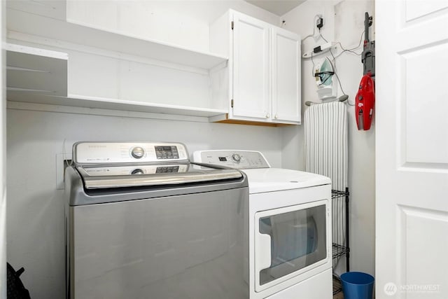 901 E Marine View Dr Unit 206, Everett, WA 98201 - washroom featuring cabinet space and independent washer and dryer