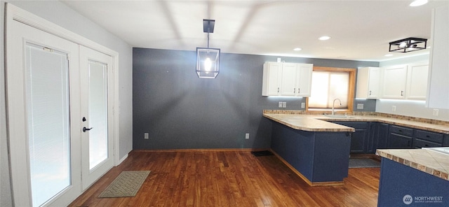 5903 187th Ave SW, Rochester, WA 98579 - kitchen with white cabinetry, dark wood-style flooring, decorative light fixtures, recessed lighting, and a peninsula