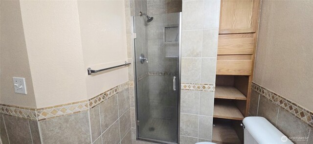 5903 187th Ave SW, Rochester, WA 98579 - full bath with tile walls, a stall shower, and wainscoting