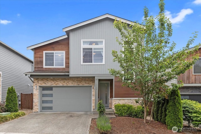 3108 122nd Pl SW, Everett, WA 98204 - view of front of home with an attached garage, stone siding, and concrete driveway