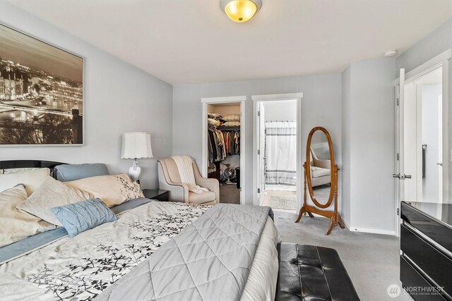 1606 94th Ave NE, Lake Stevens, WA 98258 - carpeted bedroom featuring a walk in closet, a closet, and ensuite bath