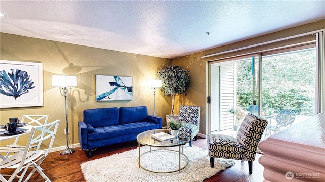 23301 Cedar Way Unit U102, Mountlake Terrace, WA 98043 - living area with wood finished floors and a textured ceiling